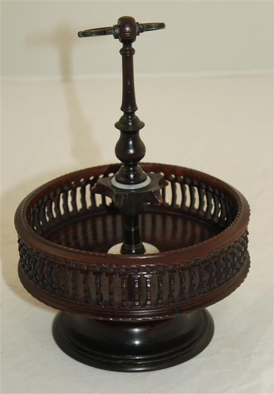 A Georgian style brass mounted turned and pierced lignum vitae cruet stand, H.9.5in.